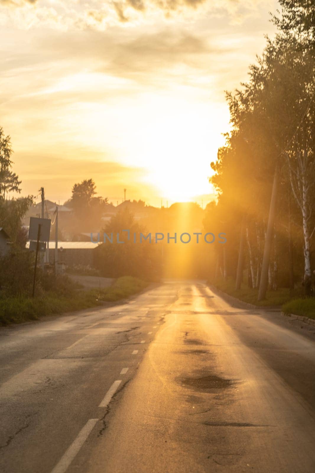 Empty city road at sunset. The road goes up. Success and growth concept. Beautiful city background