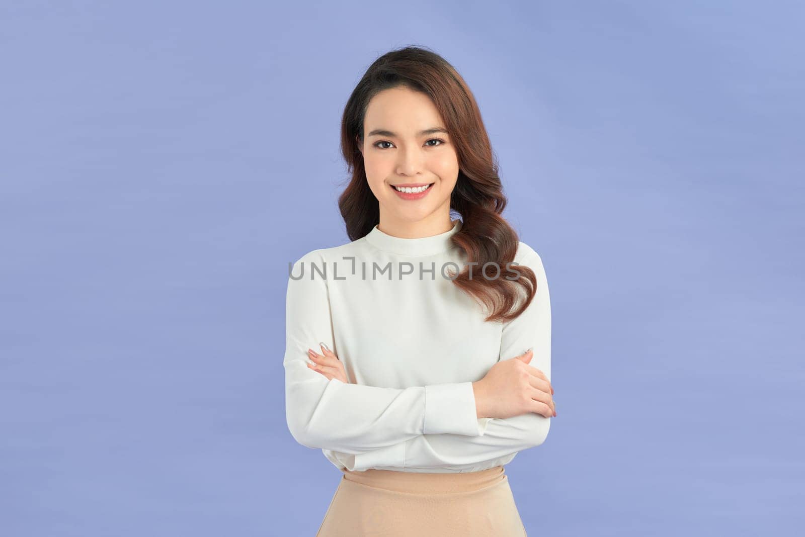 Young asian woman over isolated color background keeping the arms crossed in front position