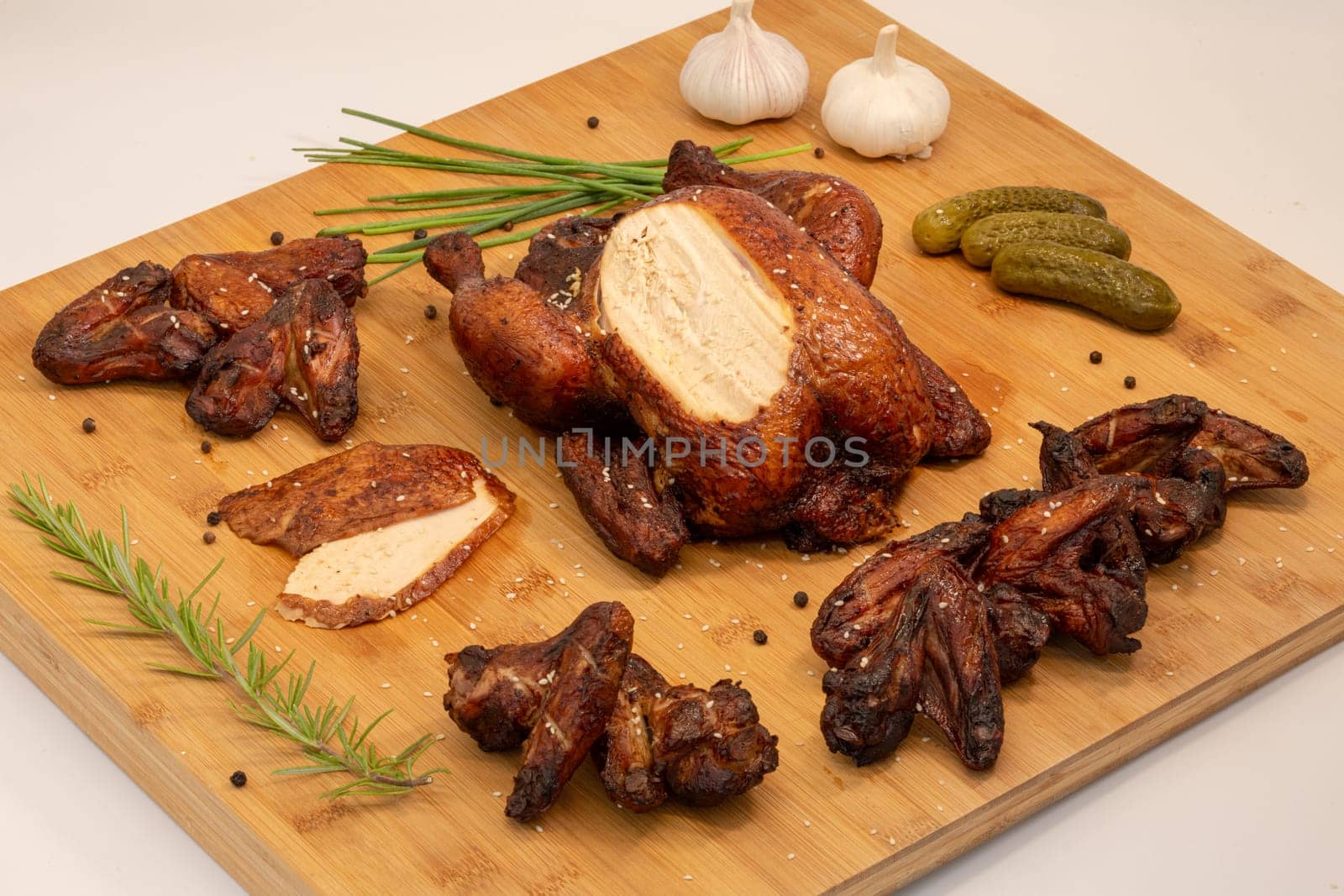 Savor the delicious experience of gourmet grilled chicken that features garlic, pickles, and a blend of fresh herbs