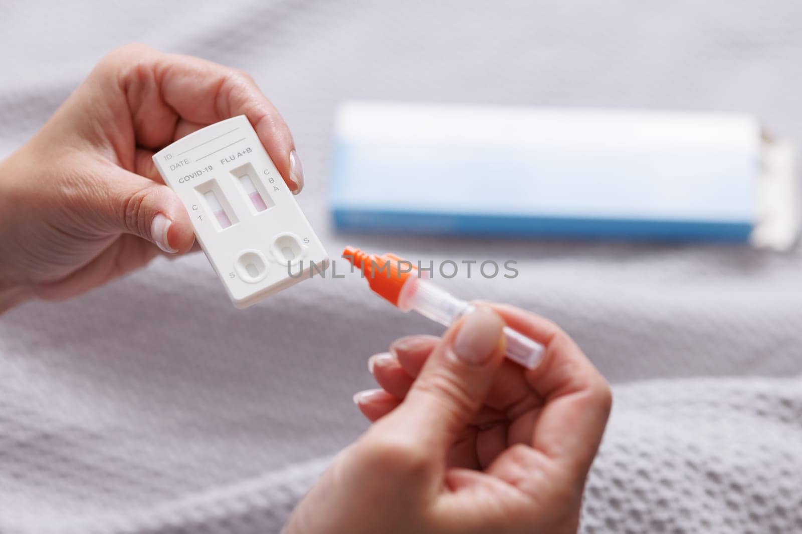 woman tests herself for new coronavirus strain at home, test for detection of covid-19 antigens and flu viruses, diagnosis of disease