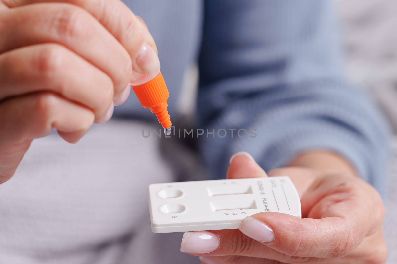 woman tests herself for new coronavirus strain at home, test for detection of covid-19 antigens and flu viruses, diagnosis of disease