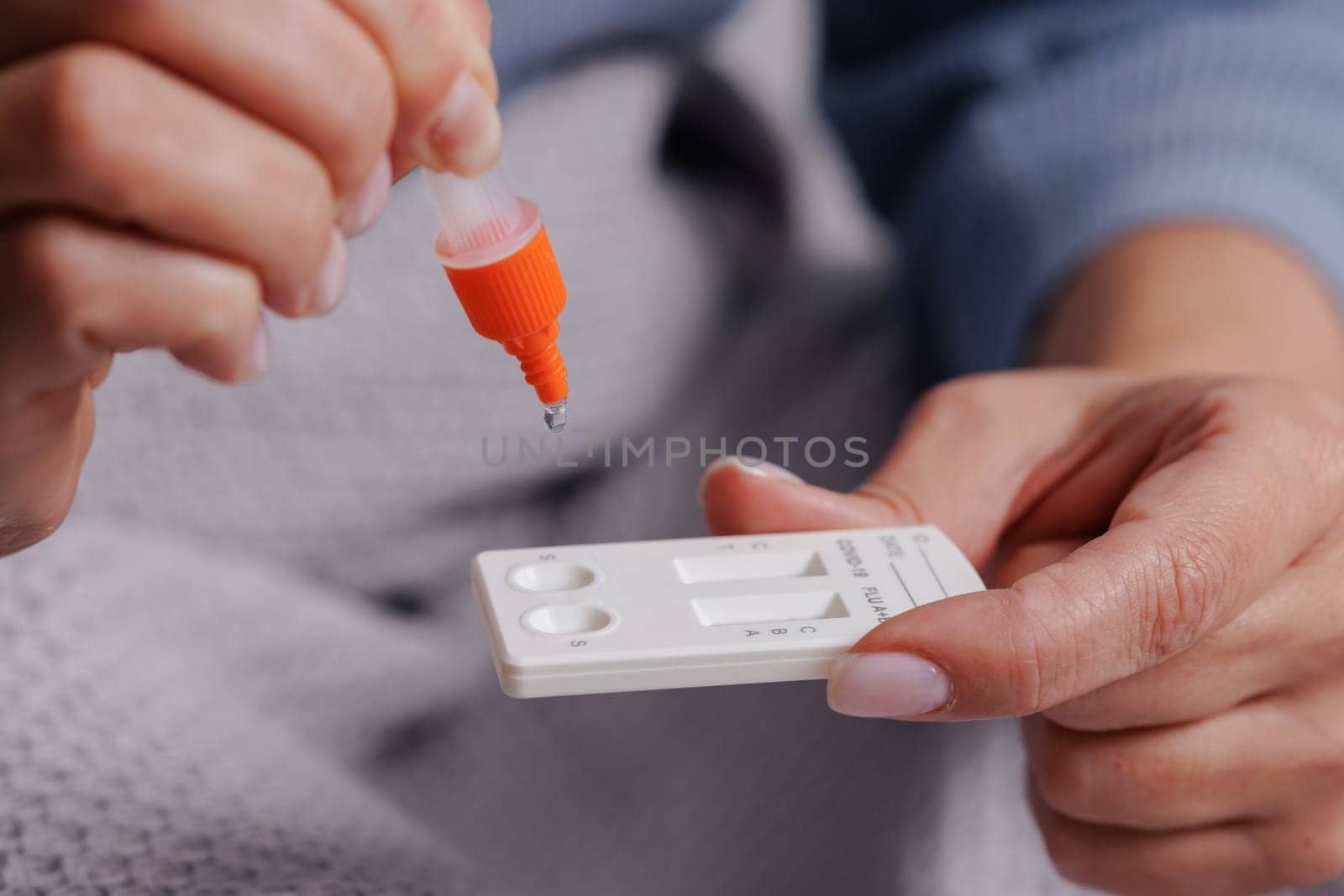woman tests herself for new coronavirus strain at home, test for detection of covid-19 antigens and flu viruses, diagnosis of disease