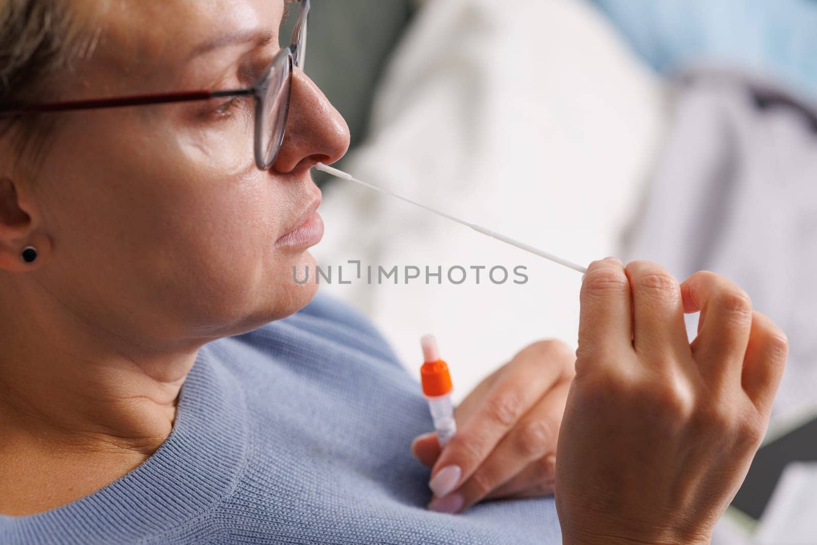woman tests herself for new coronavirus strain at home, test for detection of covid-19 antigens and flu viruses, diagnosis of disease