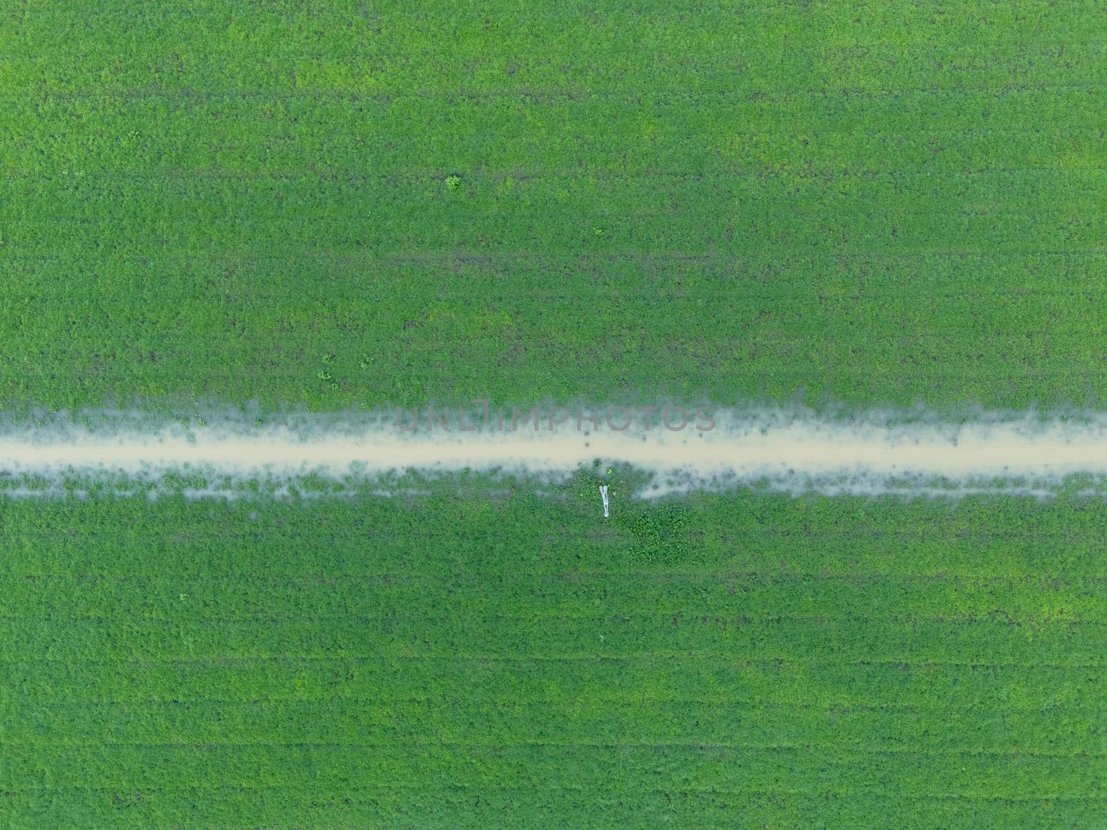 Overhead Aerial view of a flooded fields showcasing the impact of unusual heavy rainfall on rural landscapes during autumn