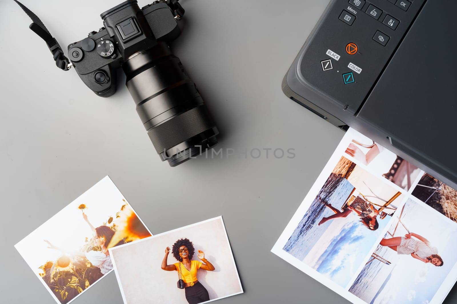 Printer and photo camera on the table. Printing photos concept