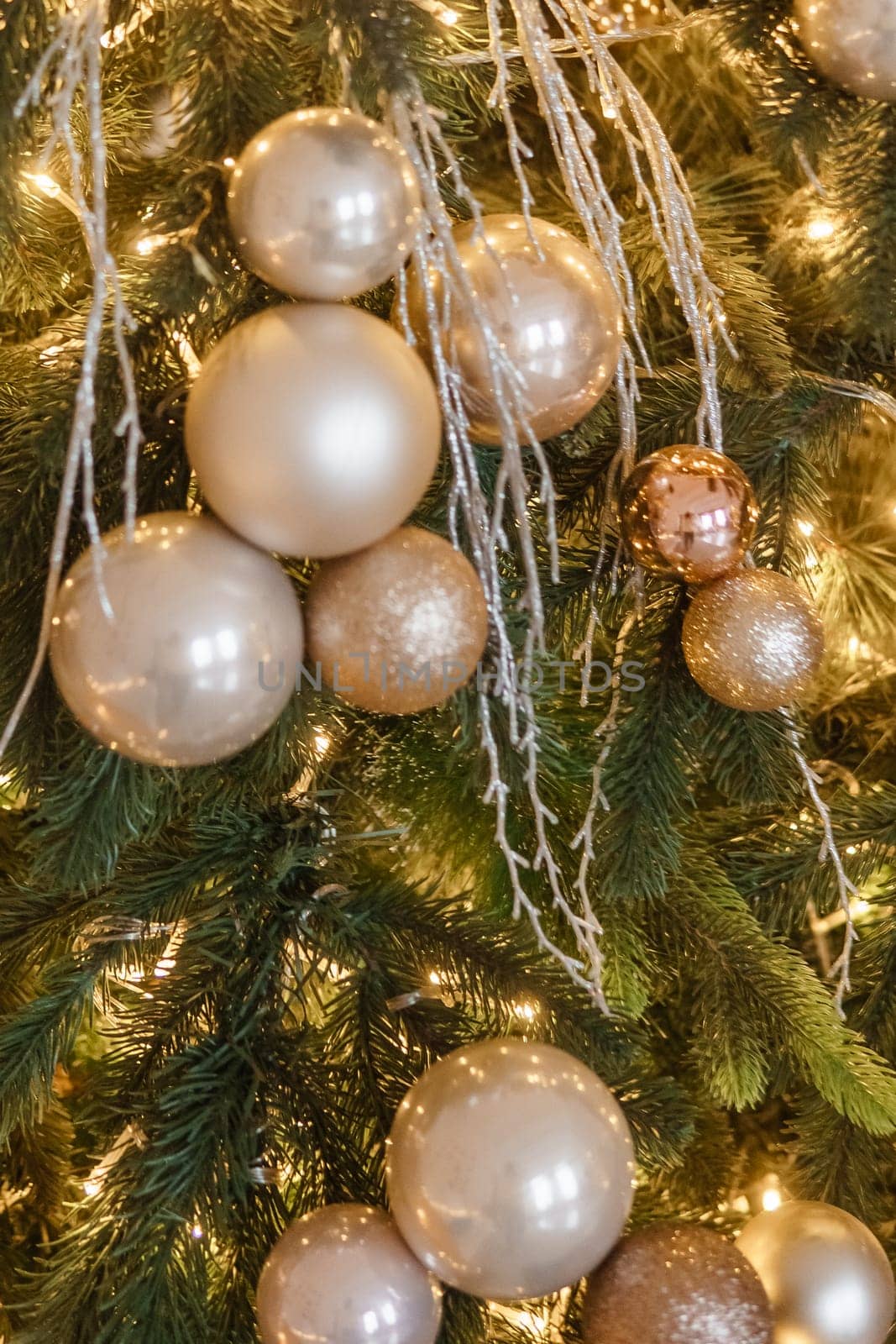 Christmas balls in close-up on the Christmas tree. Decorations for Christmas trees. The concept of celebrating New Year and Christmas