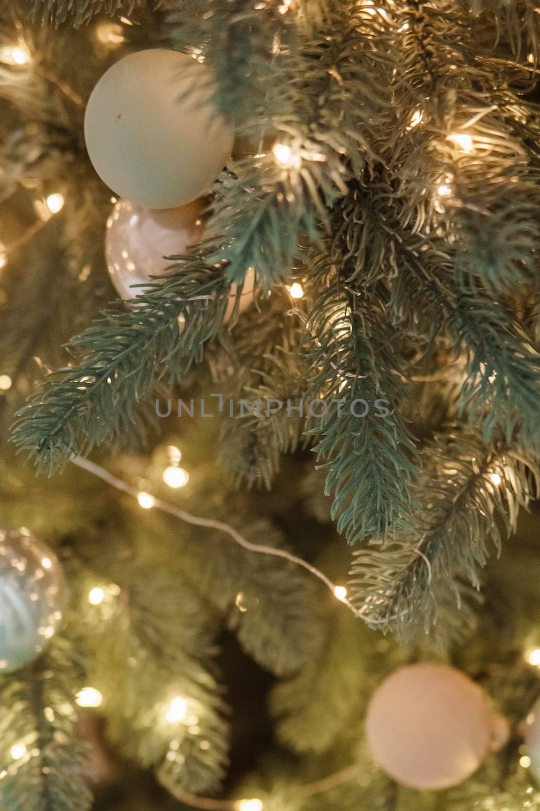 Christmas balls in close-up on the Christmas tree. Decorations for Christmas trees. The concept of celebrating New Year and Christmas
