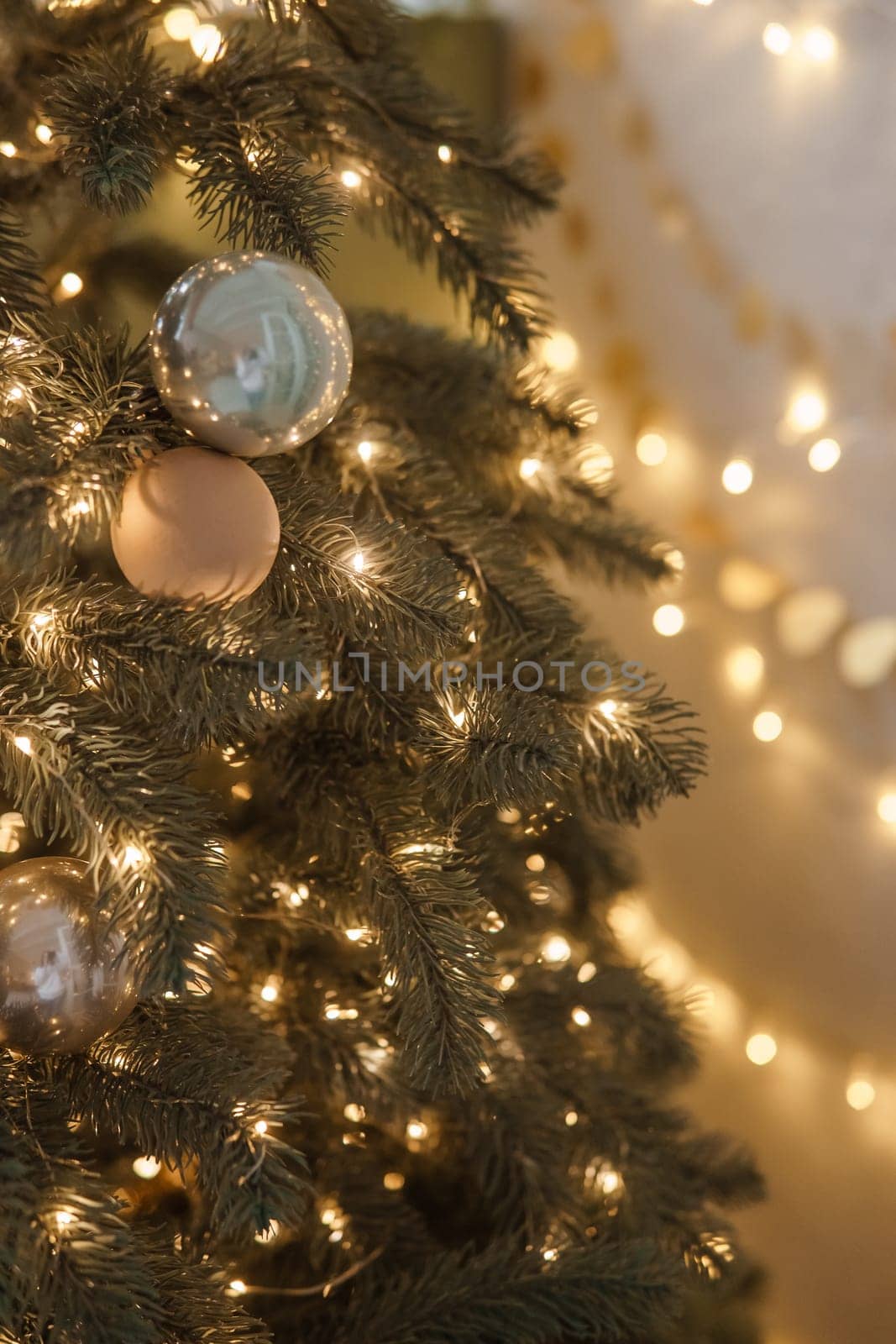 Christmas balls in close-up on the Christmas tree. Decorations for Christmas trees. The concept of celebrating New Year and Christmas