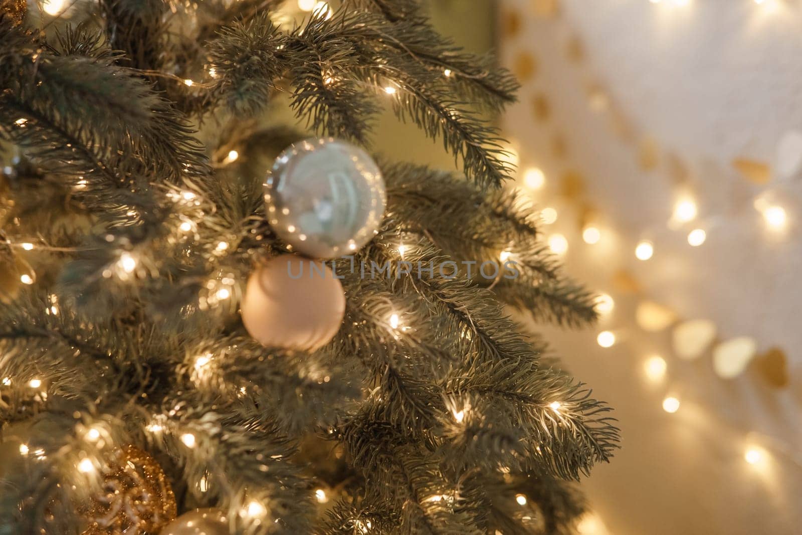 Christmas balls in close-up on the Christmas tree. Decorations for Christmas trees. The concept of celebrating New Year and Christmas