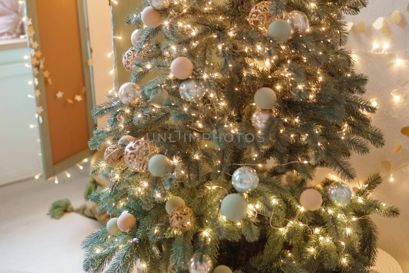 Christmas balls in close-up on the Christmas tree. Decorations for Christmas trees. The concept of celebrating New Year and Christmas