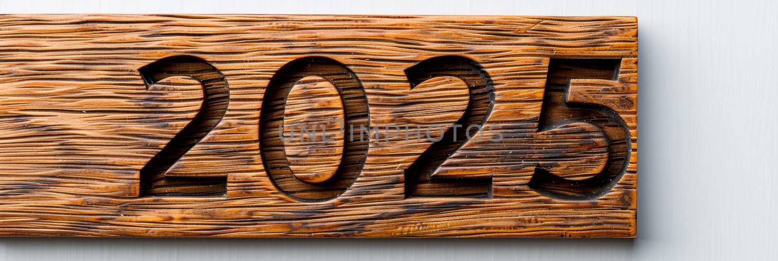 Large 2025 bold number on clean wooden background for new year and future themed concepts