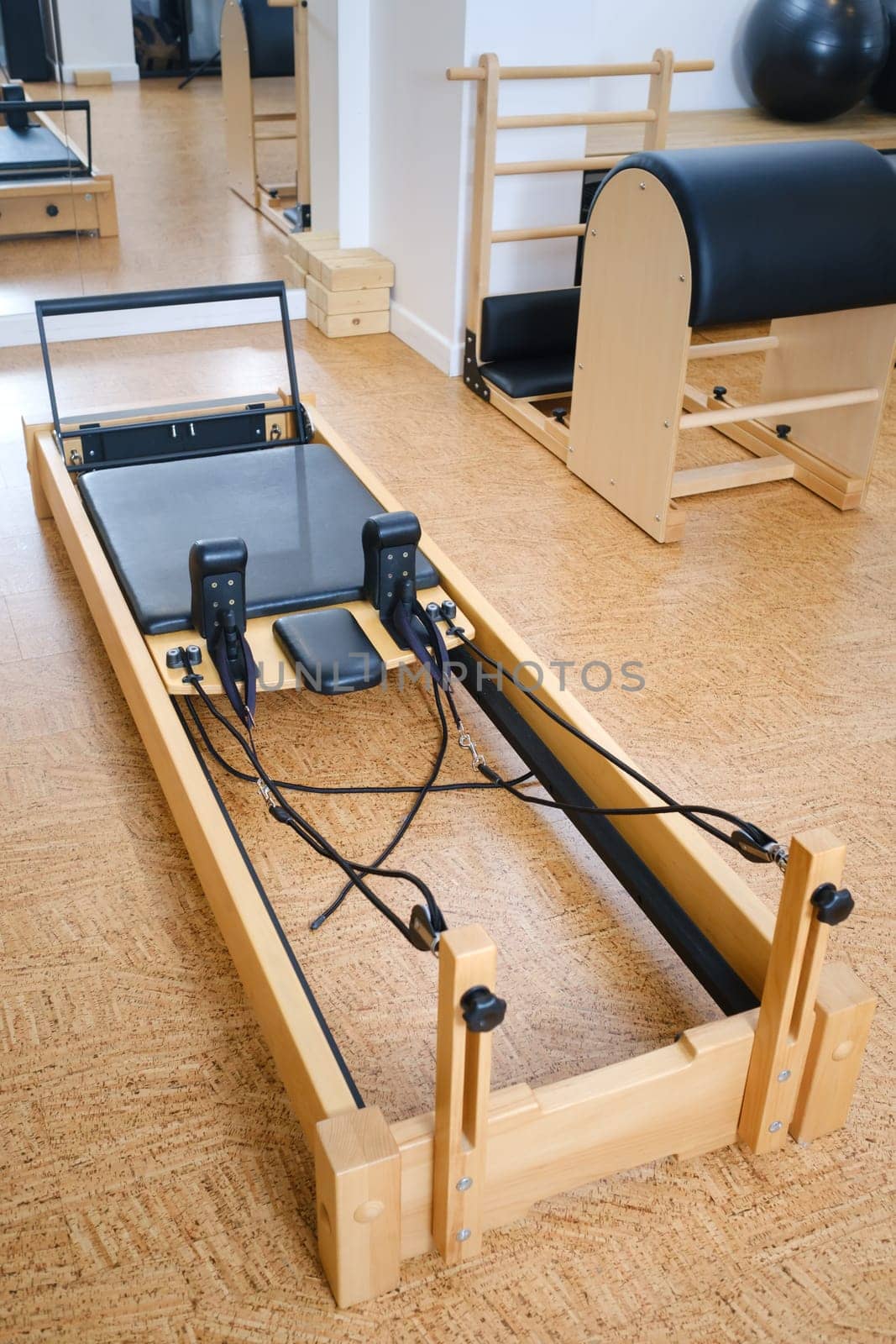 the reformer machine in the pilates room. Yoga equipment.