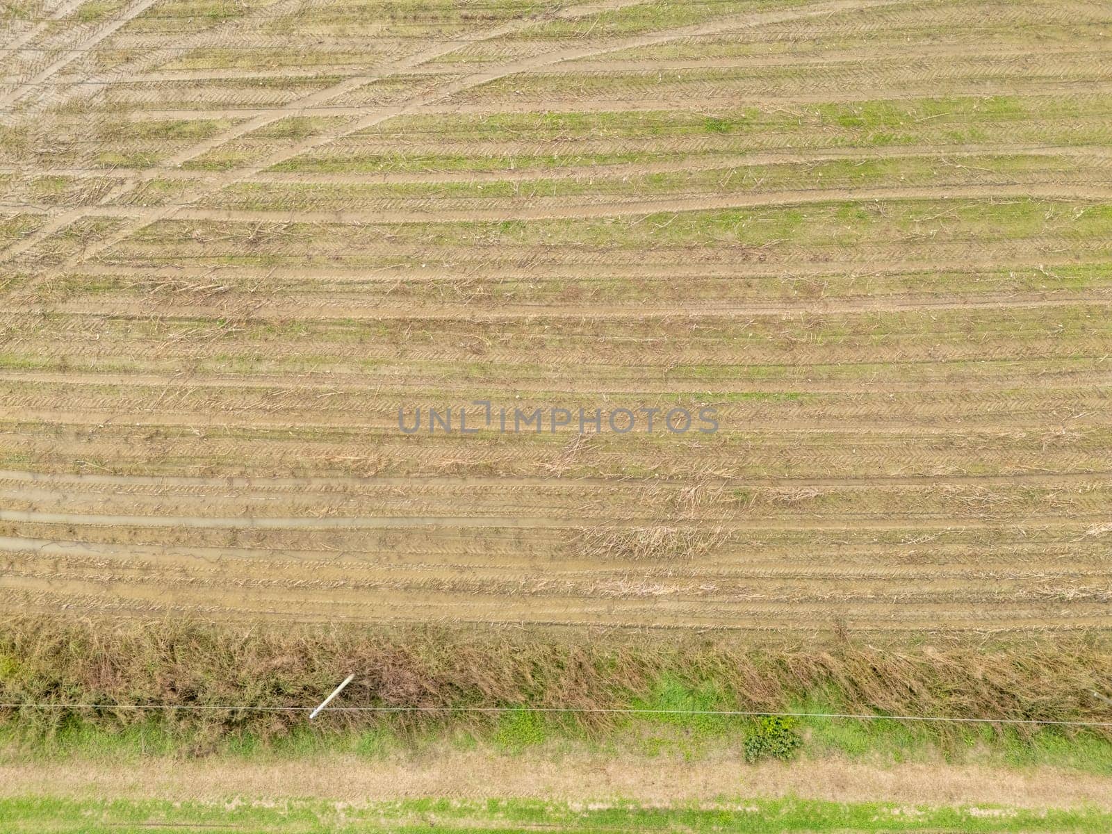 Overhead Aerial view of a flooded fields showcasing the impact of unusual heavy rainfall on rural landscapes during autumn