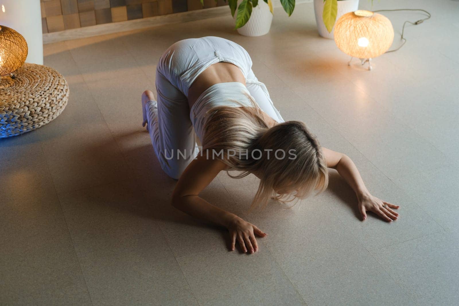 Girl doing meditating bodywork at the gym . Girl doing yoga in the gym.