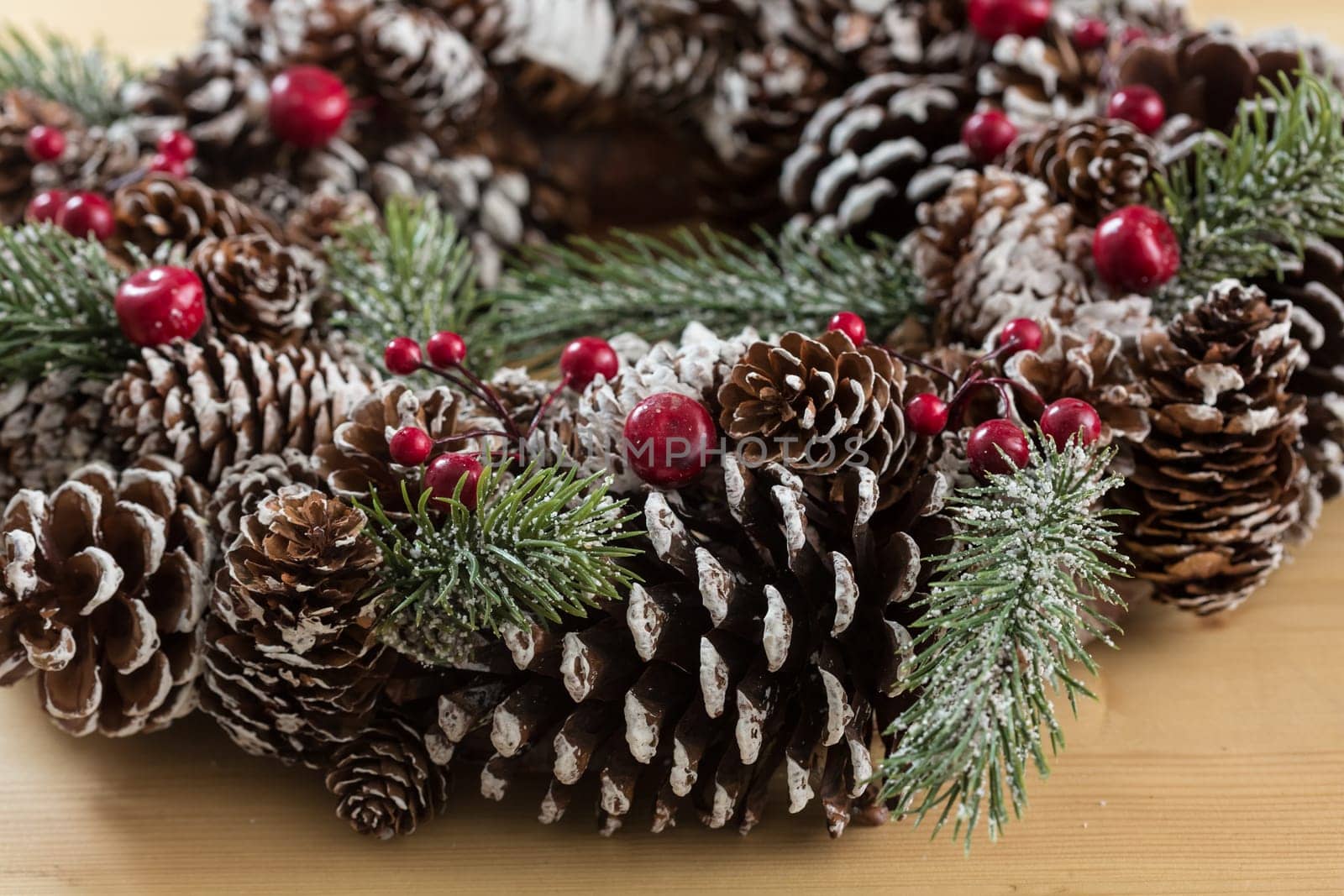 Closeup of elegant christmas wreath decorated pine cones and fir trees. Christmas mood