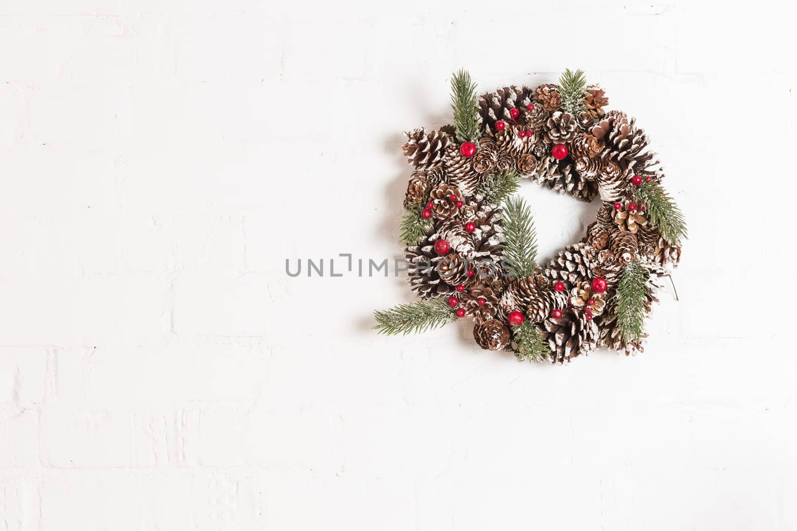 Elegant christmas wreath decorated pine cones and fir trees. Christmas mood