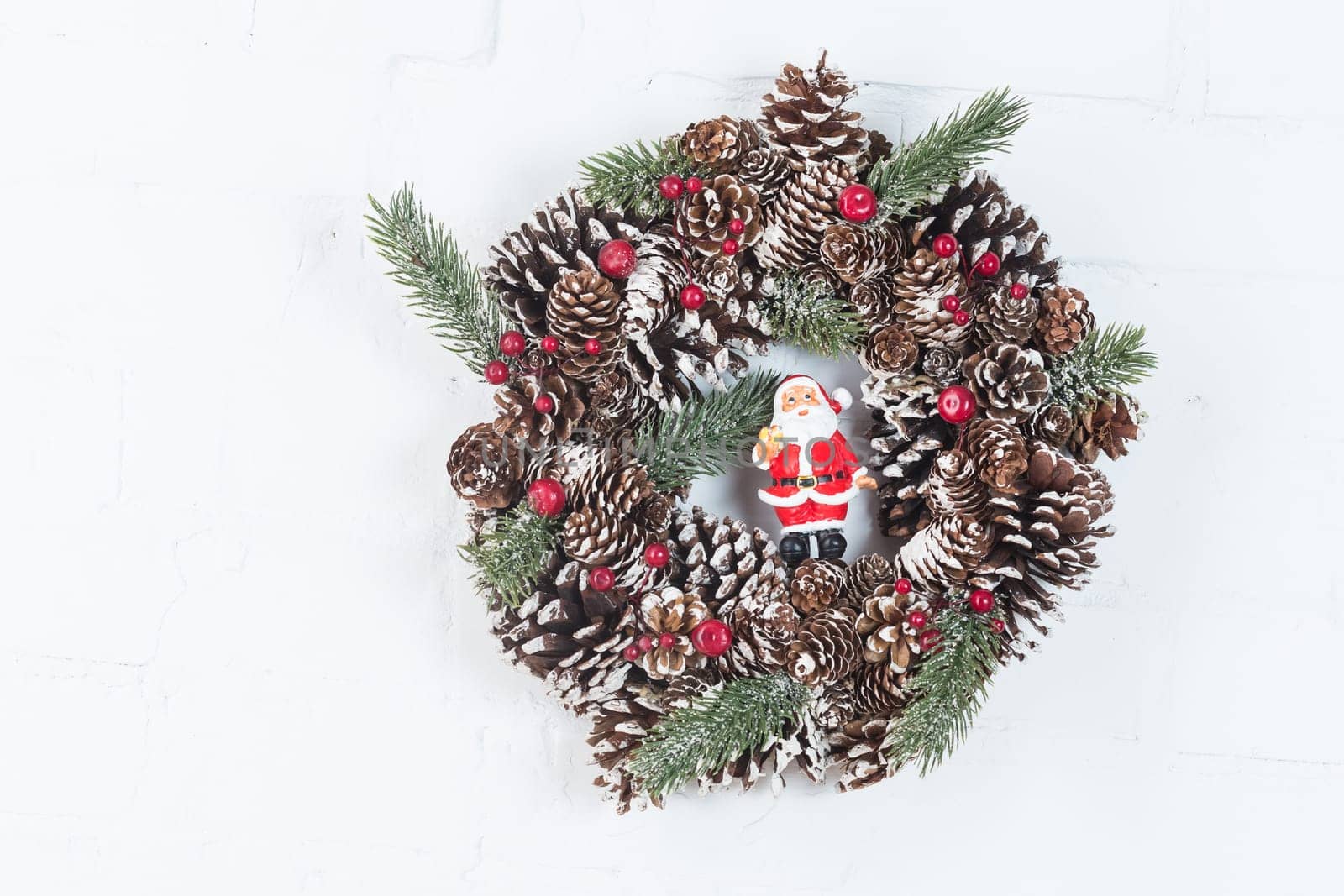 Elegant christmas wreath decorated pine cones and fir trees. Christmas mood