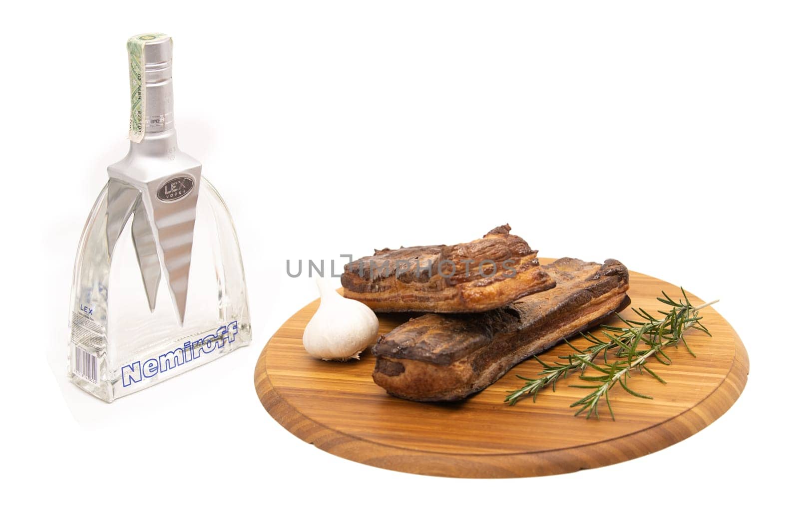 Delicious artisanal whole smoked slab bacon on a cutting block.
