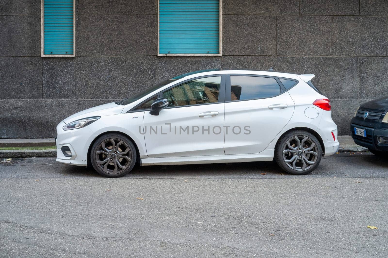 Cremona, Lombardy, Italy October 15th 2024 A white ford fiesta st line is parked on an urban side street, showcasing its sporty design and modern features