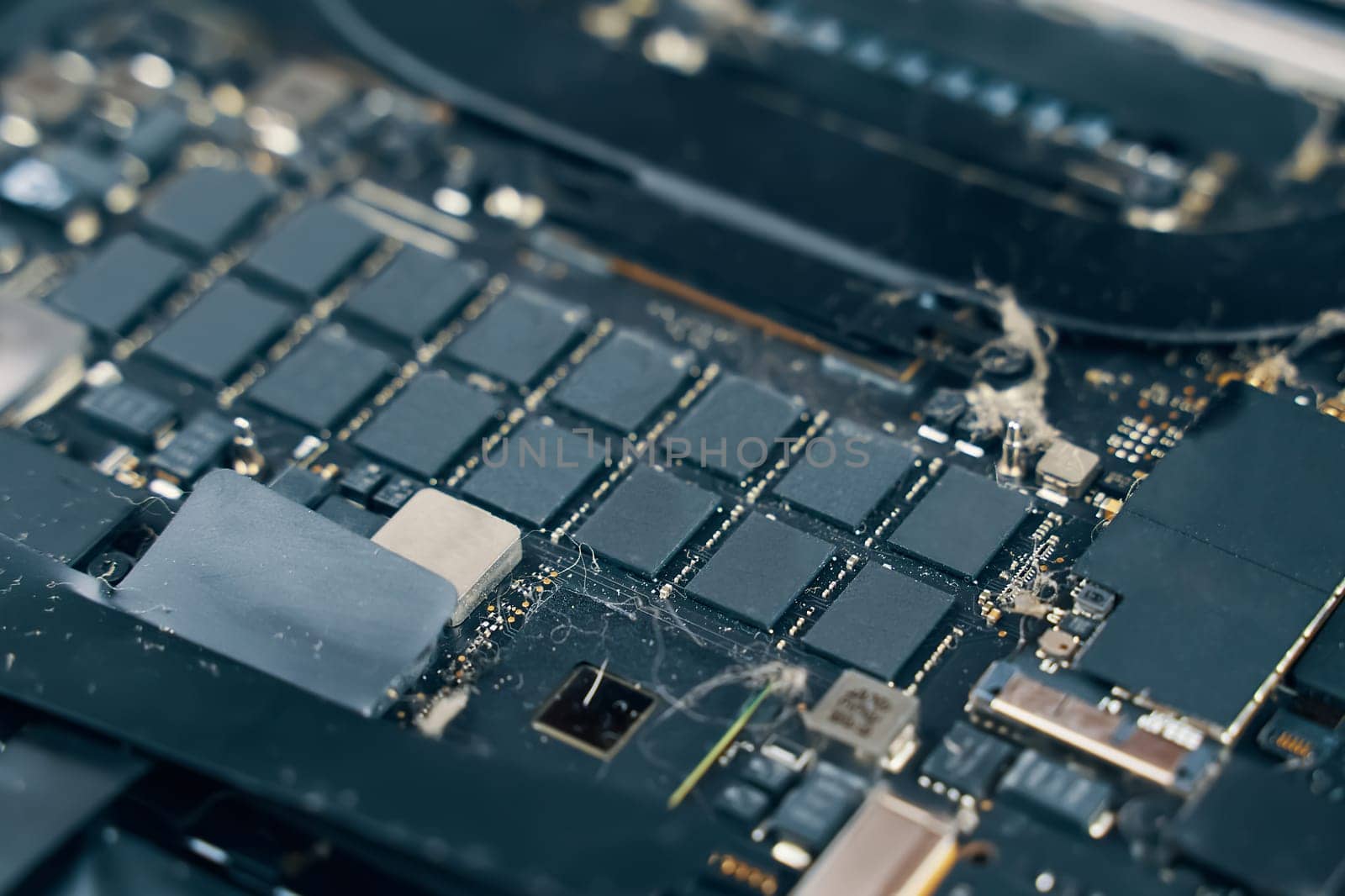 A detailed image of a circuit board showcasing various microchips and electronic components used in devices