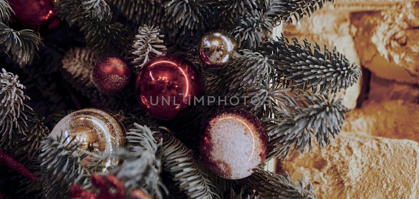 Background for Christmas and New Year's Eve. Beautiful wide angle holiday template with Christmas ball on the tree and glare.