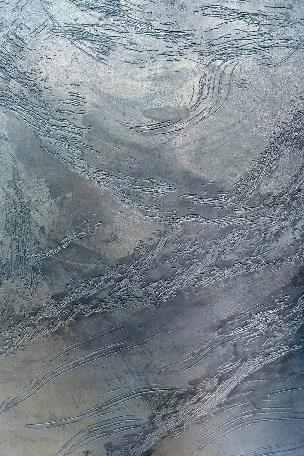 Gray texture of decorative Venetian plaster close-up
