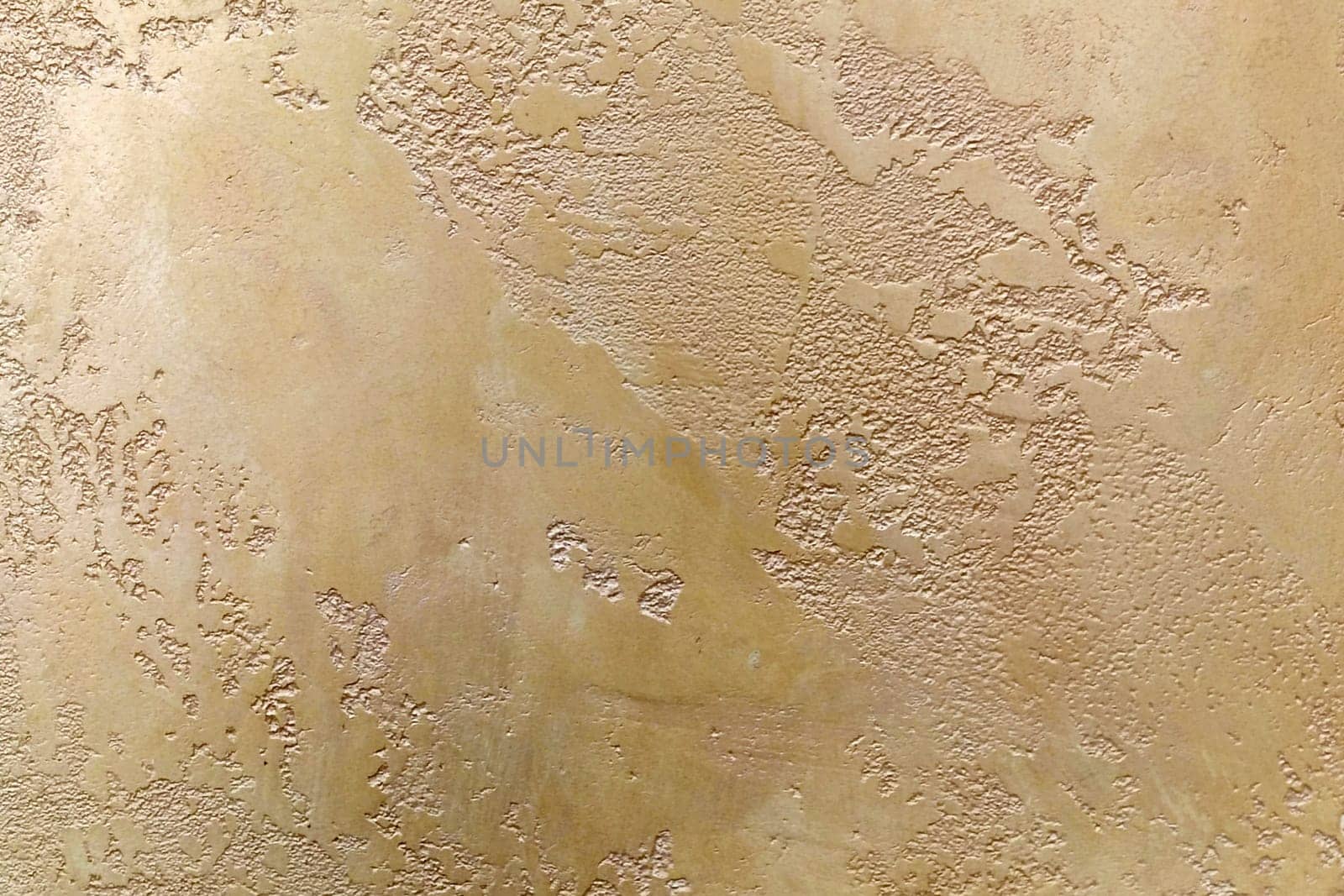Light brown texture of decorative plaster Travertine close-up