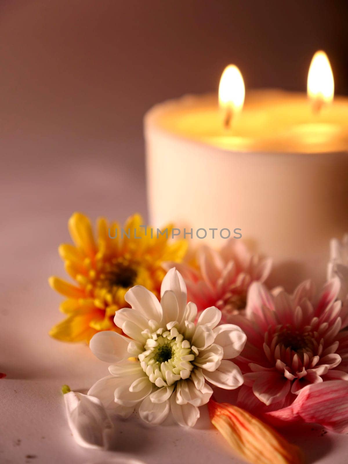 Celebration of Diwali or Deepavali holiday in India with candles and flowers in the evening at night close-up. Hindus celebrate the festival of lights
