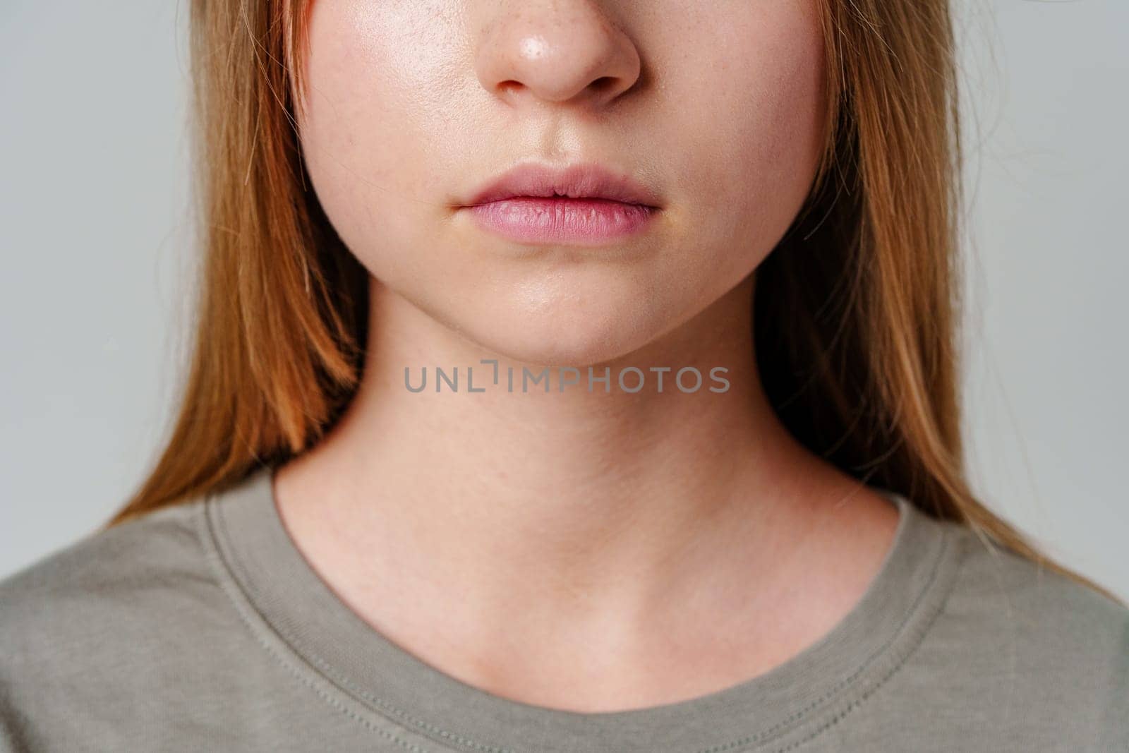 A close-up view of a young woman's face highlighting her natural features