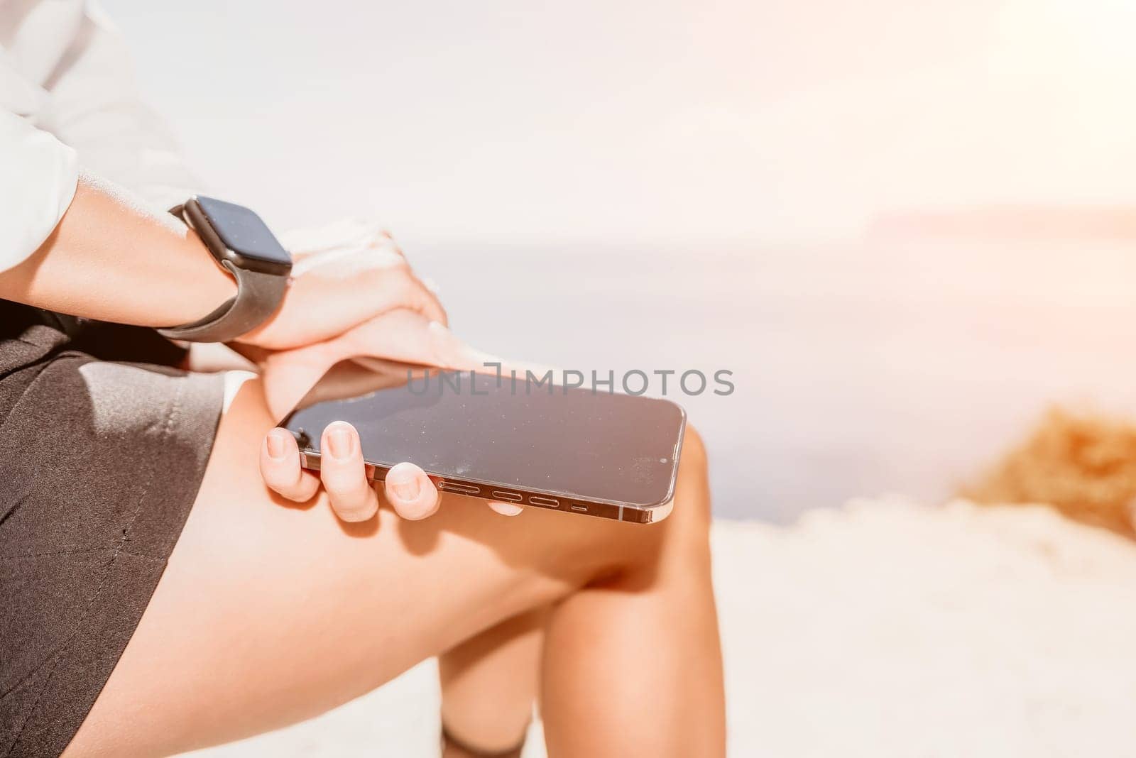 Woman sea laptop. Business woman in yellow hat freelancer with laptop working over blue sea beach. Girl relieves stress from work. Freelance, digital nomad, travel and holidays concept by panophotograph