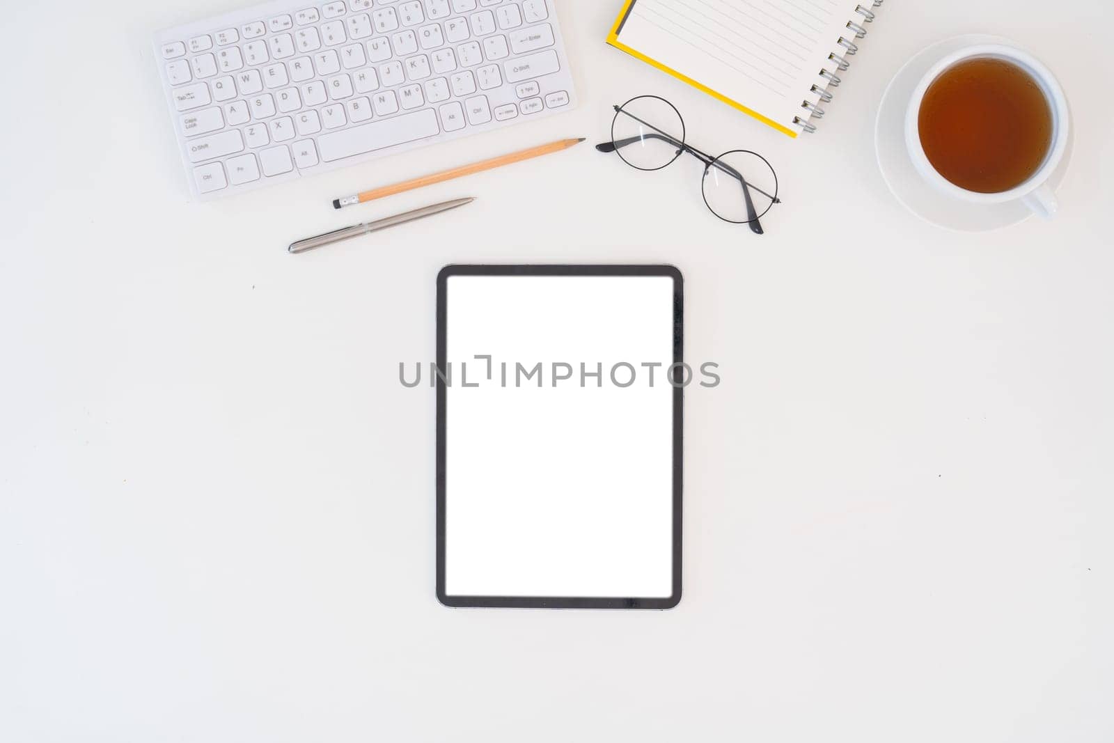 Modern desk workspace with blank copy space mockup with blank screen tablet, coffee cup, technology, headphones with equipment other office top view freelance business concept for social media.