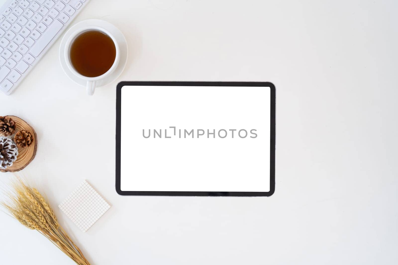 Modern desk workspace with blank copy space mockup with blank screen tablet, coffee cup, technology, headphones with equipment other office top view freelance business concept for social media.