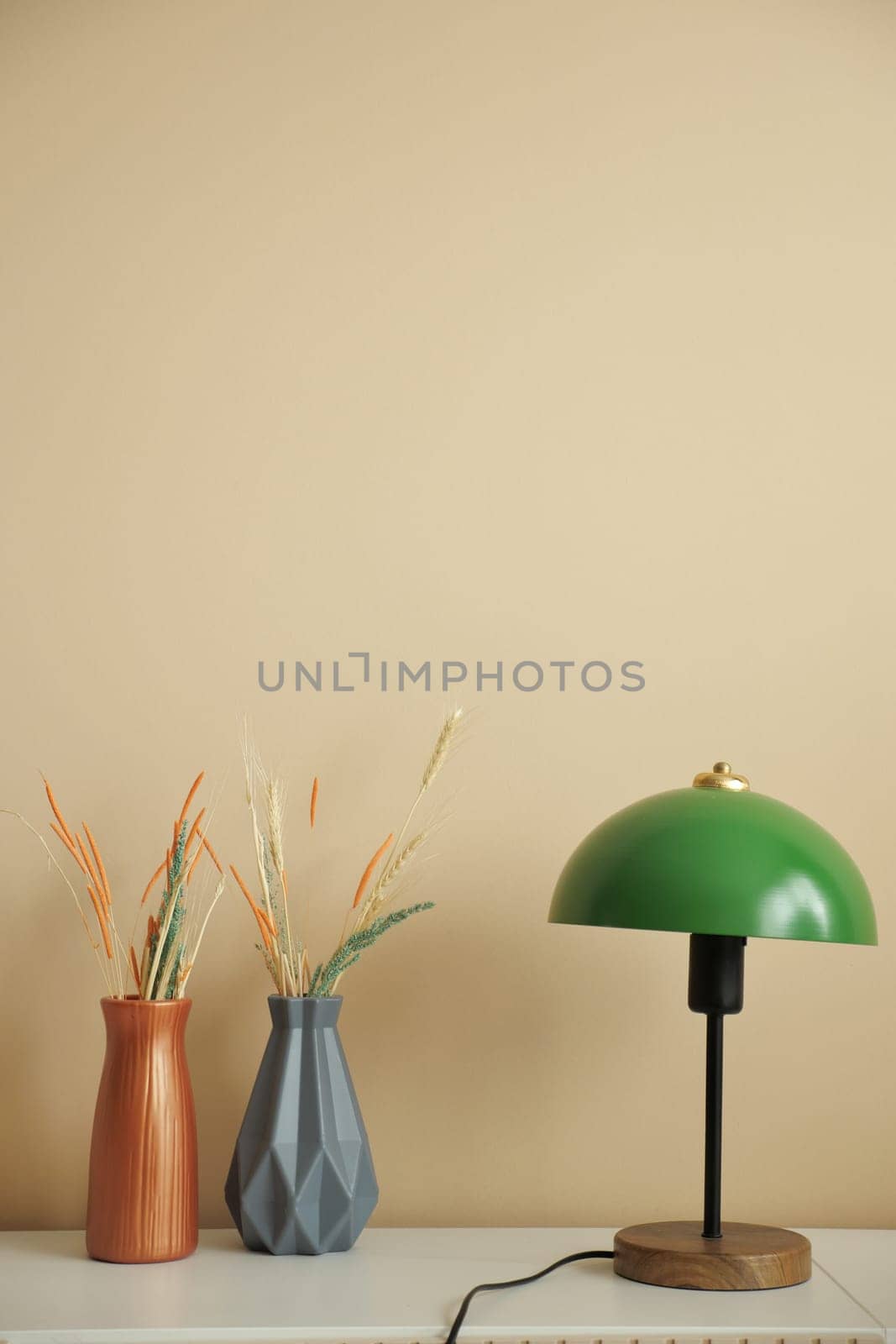 a lamp in home against white wall .