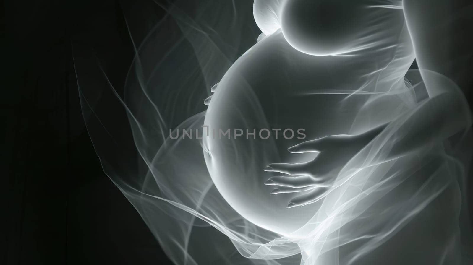 Glowing pregnant woman holding her belly with one hand on black background.