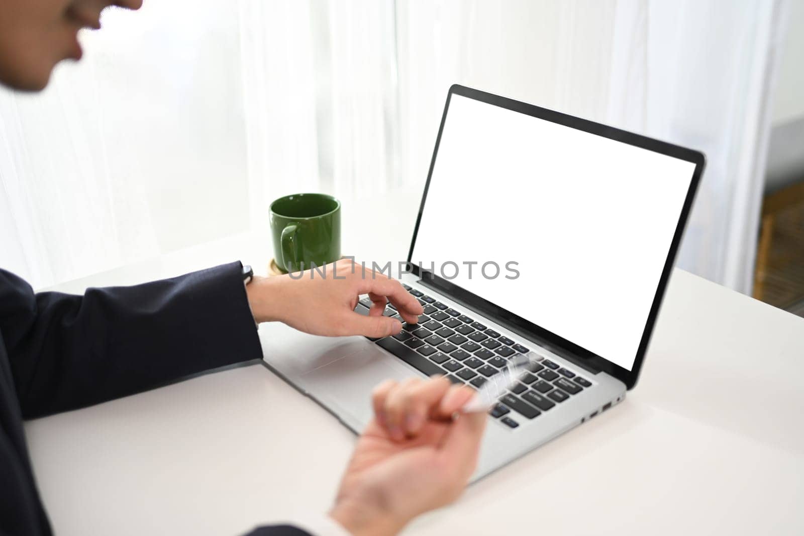 Close up shot businessman making a purchase or payment with credit card online.