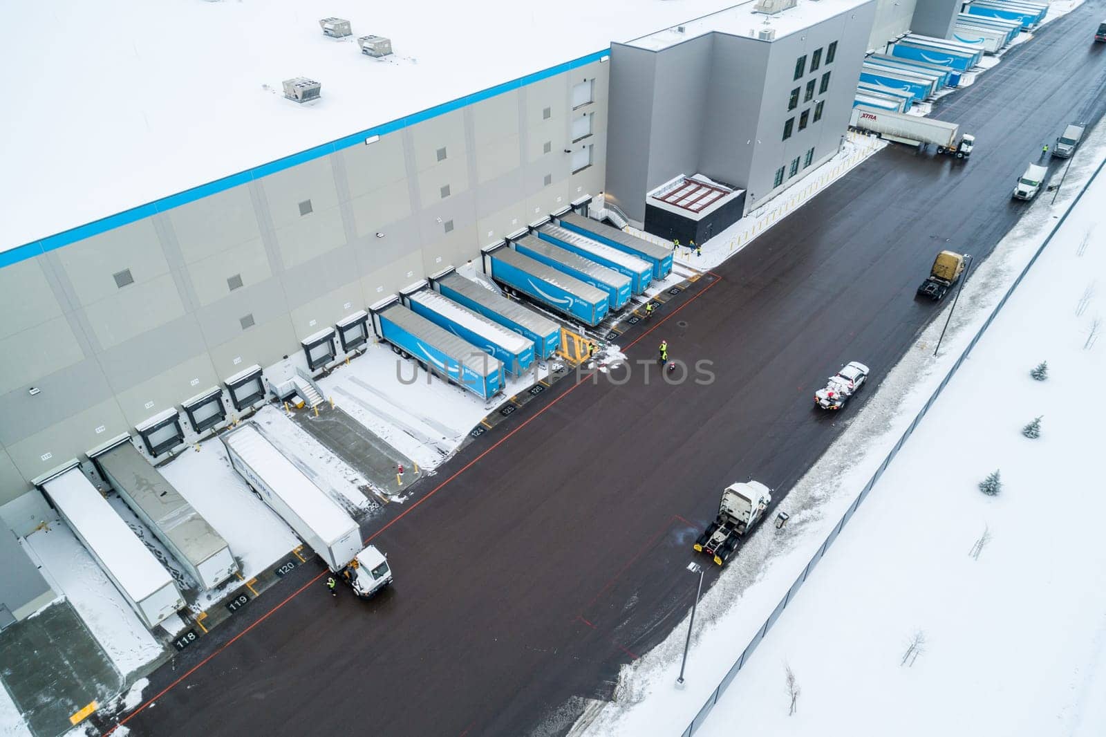 Nampa, Idaho - December 29 2021: Aerial view of the amazon building while they are loading up truck trailers
