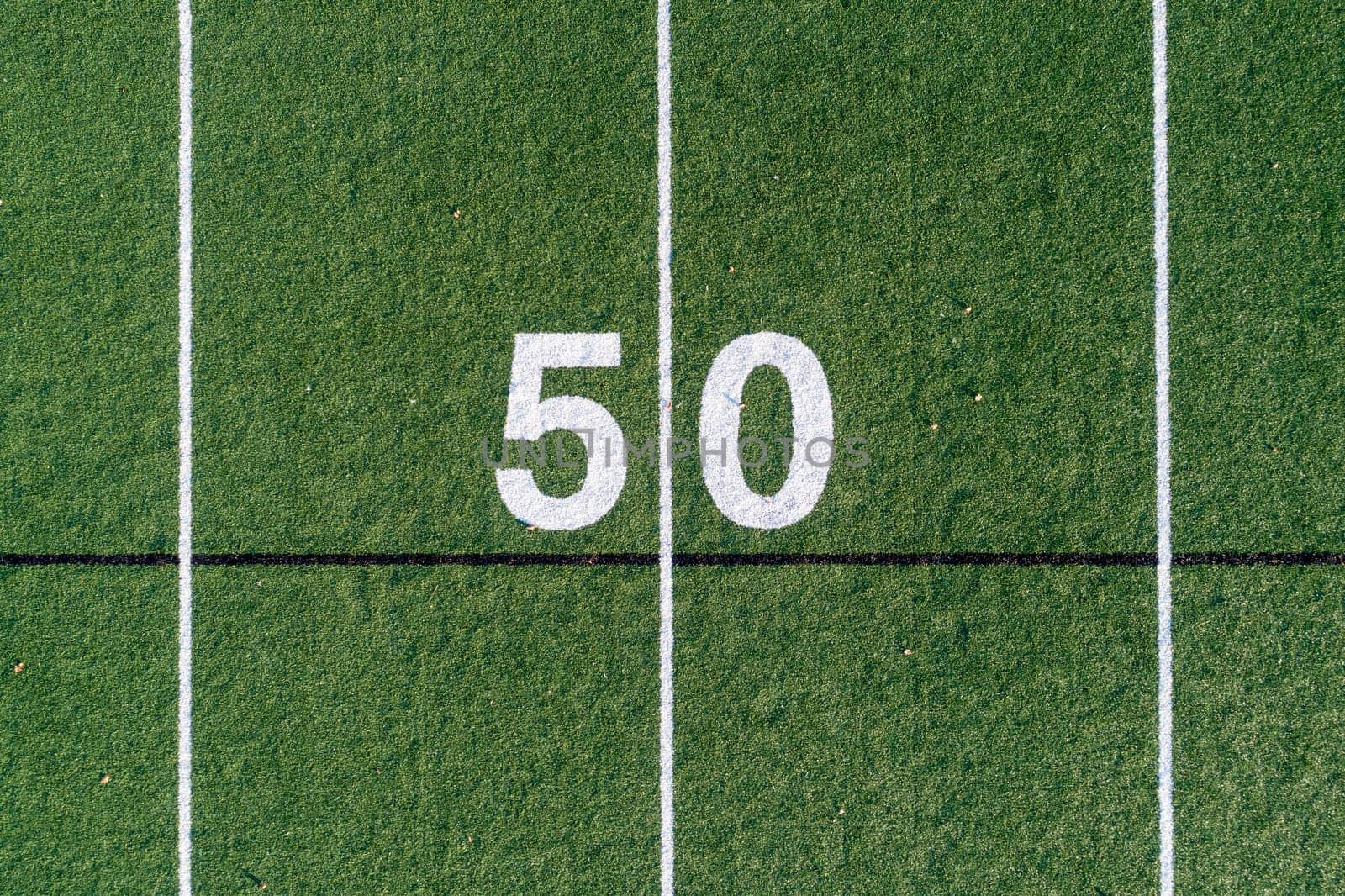 view looking down at the 50 yard line on a football field