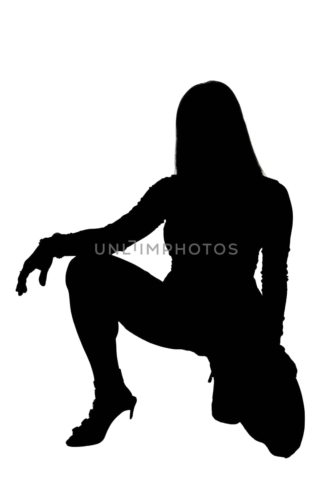 The elegant silhouette of a woman peacefully sitting on the ground with her legs elegantly crossed beneath her, creating a striking image