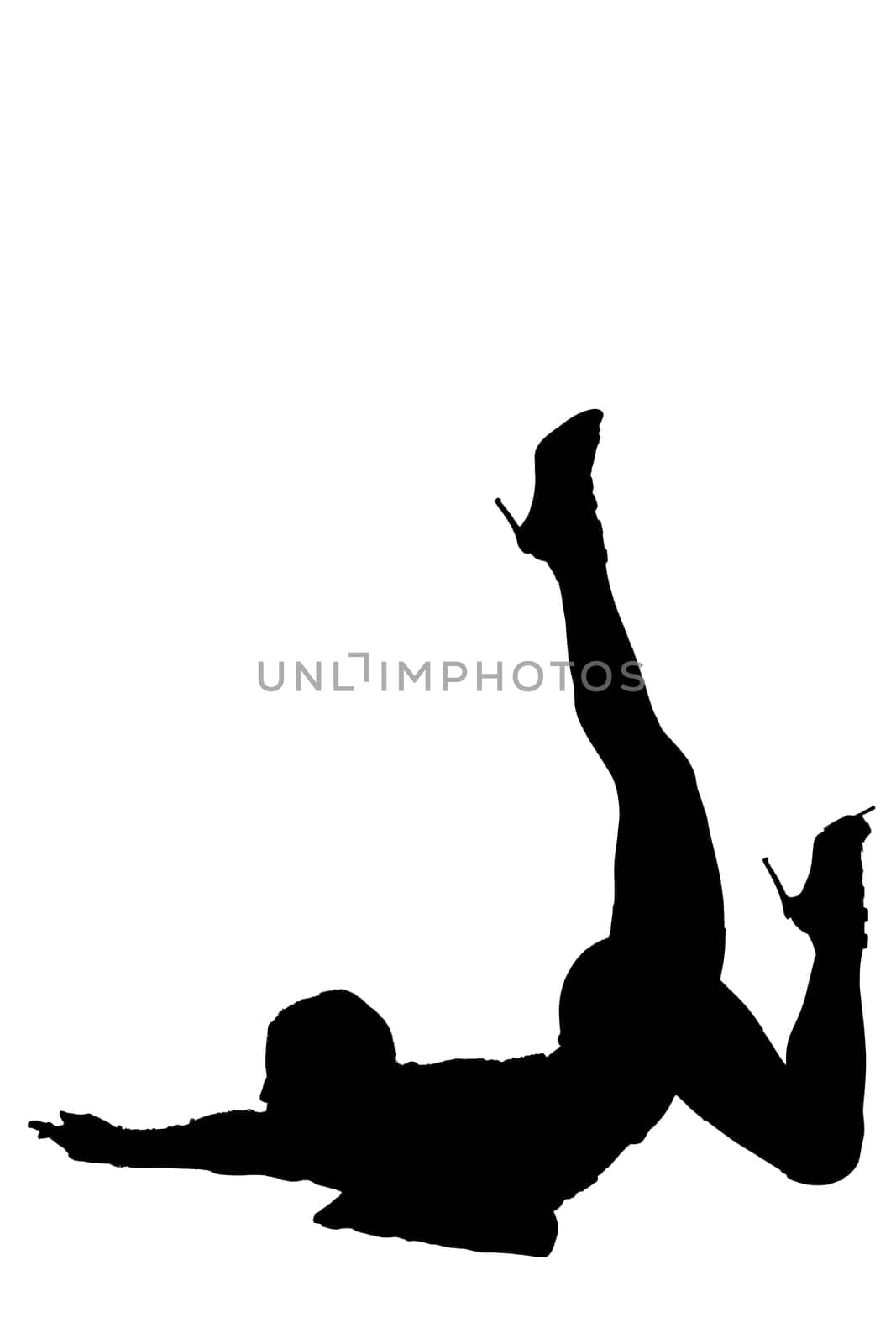 A striking silhouette of a woman effortlessly laying on the floor with her legs playfully elevated in the air, creating a dynamic pose