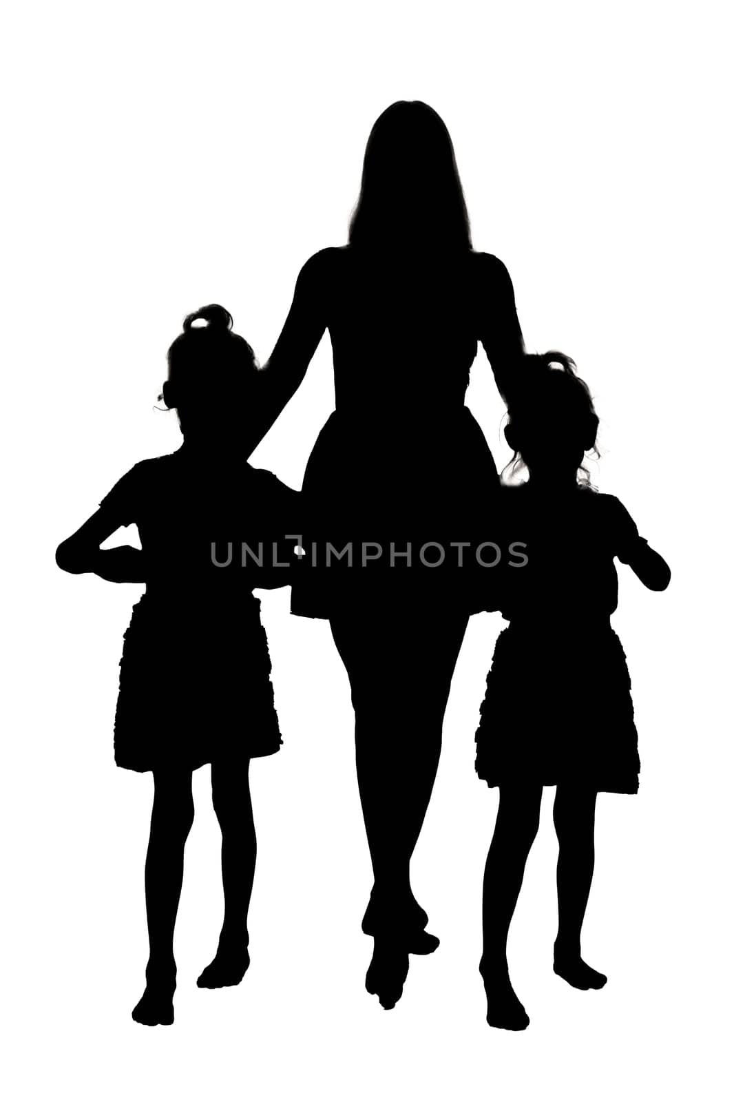 The distinct silhouette of a woman gracefully walking alongside two small girls who appear to be happily enjoying their time together