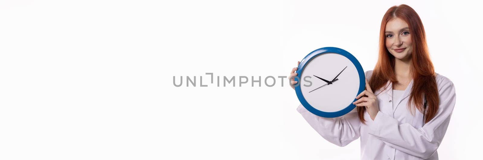 A young woman with long hair is proudly displaying a vibrant blue clock, symbolizing effective time management