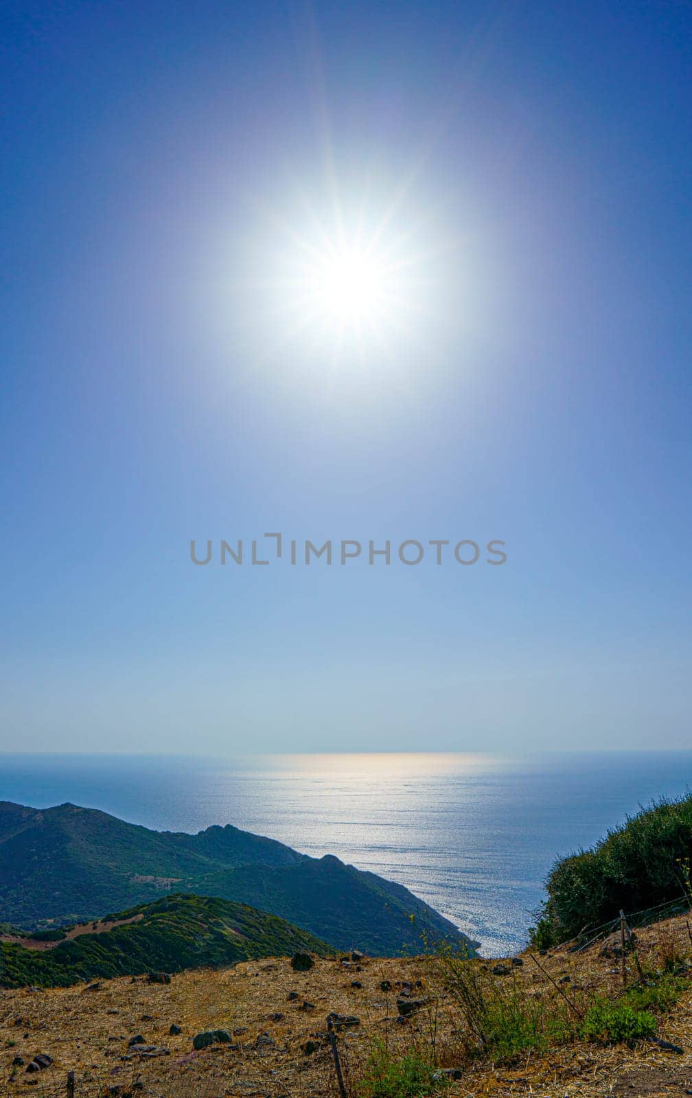 View of the Mediterranean Sea with the sun backlit. Sardinia, Italy
