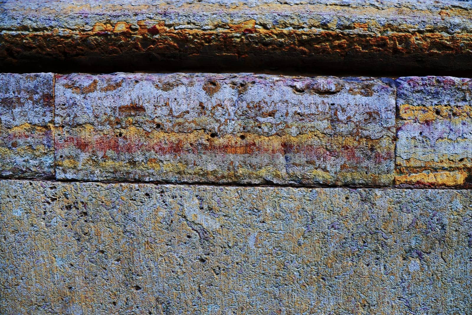 Fragment of the wall of an old building. Antique wall made of different stones.