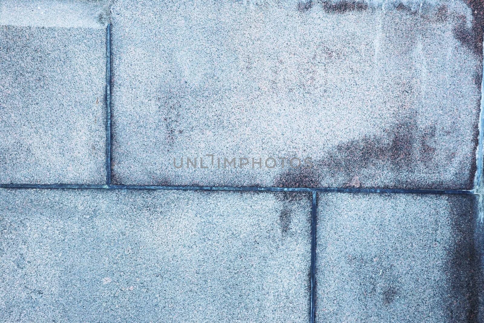 Fragment of an old abandoned wall, brick and tile. Blue wall.
