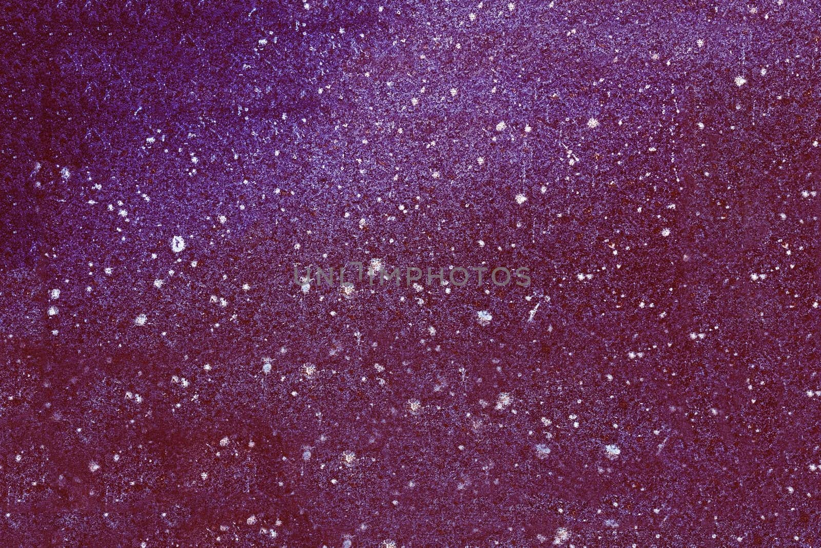 The surface of the stone is painted purple.