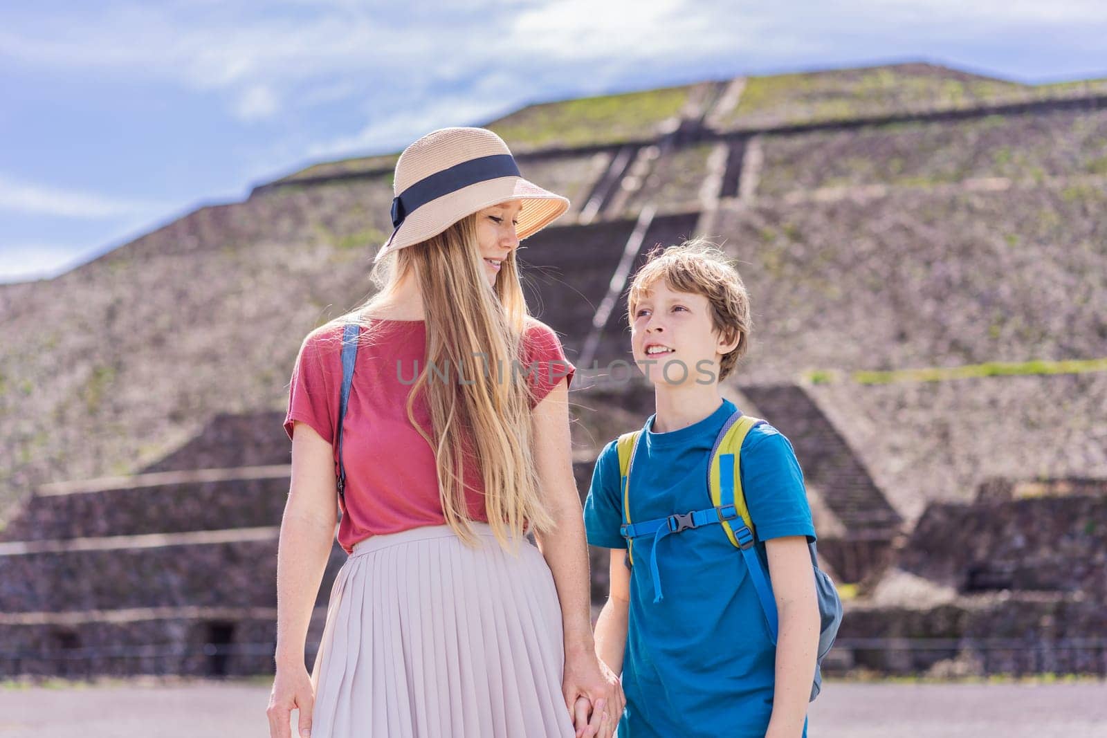 Mother and son tourists exploring Teotihuacan, Mexico. Cultural heritage, ancient ruins, and archaeological adventure concept.