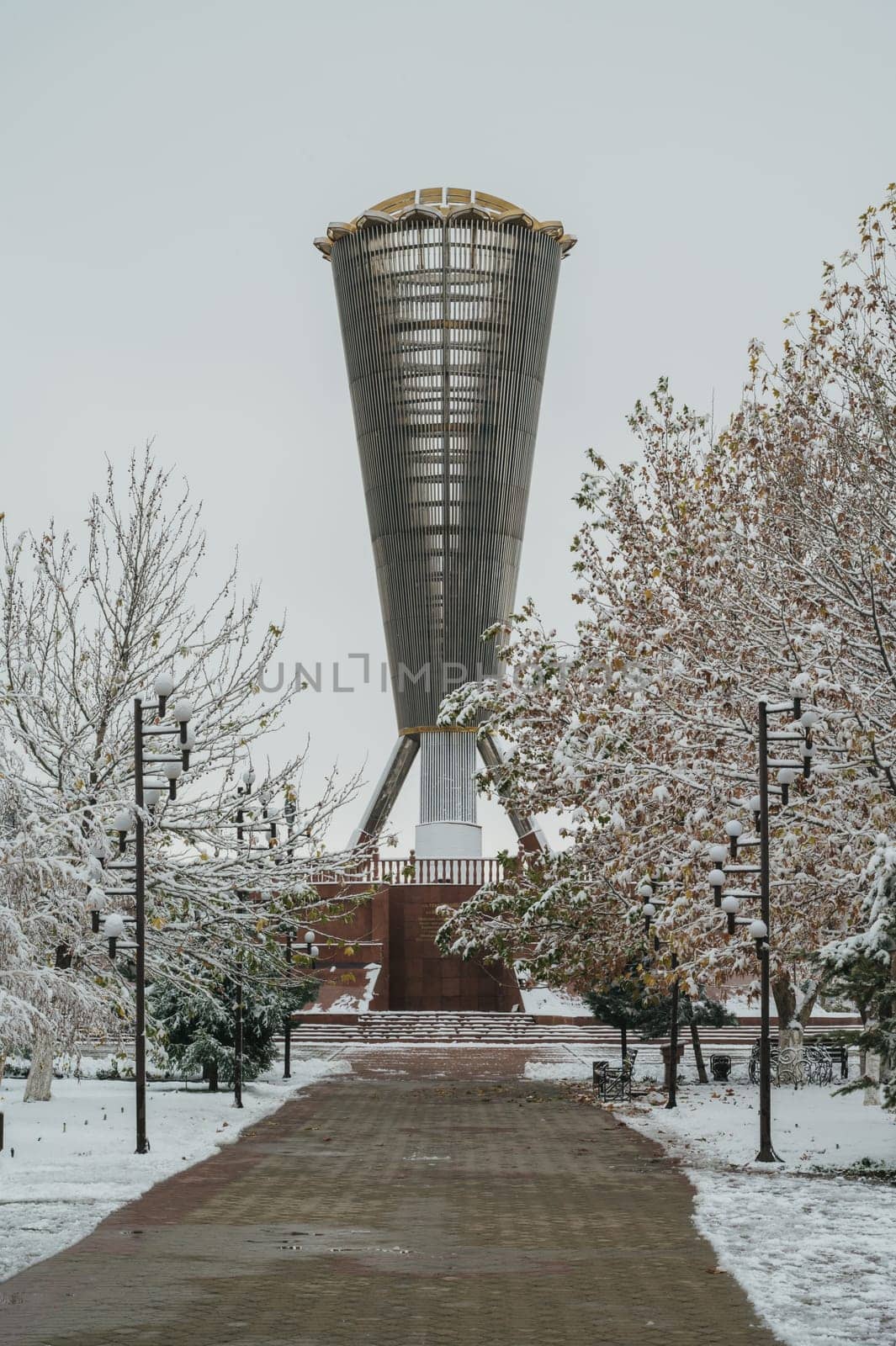 SHYMKENT, KAZAKHSTAN - DECEMBER 09, 2023: Monument Altyn Shanyrak in Independence Park in Shymkent city in Southern Kazakhstan in winter with snow