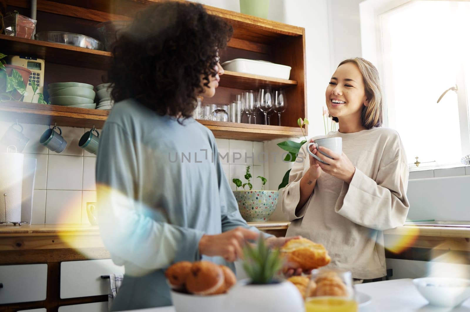 Lesbian, women and couple with marriage, breakfast and romance with conversation, support and bonding. Lgbtq, girls and queer people in a kitchen, home and relationship with trust, talking and love by YuriArcurs