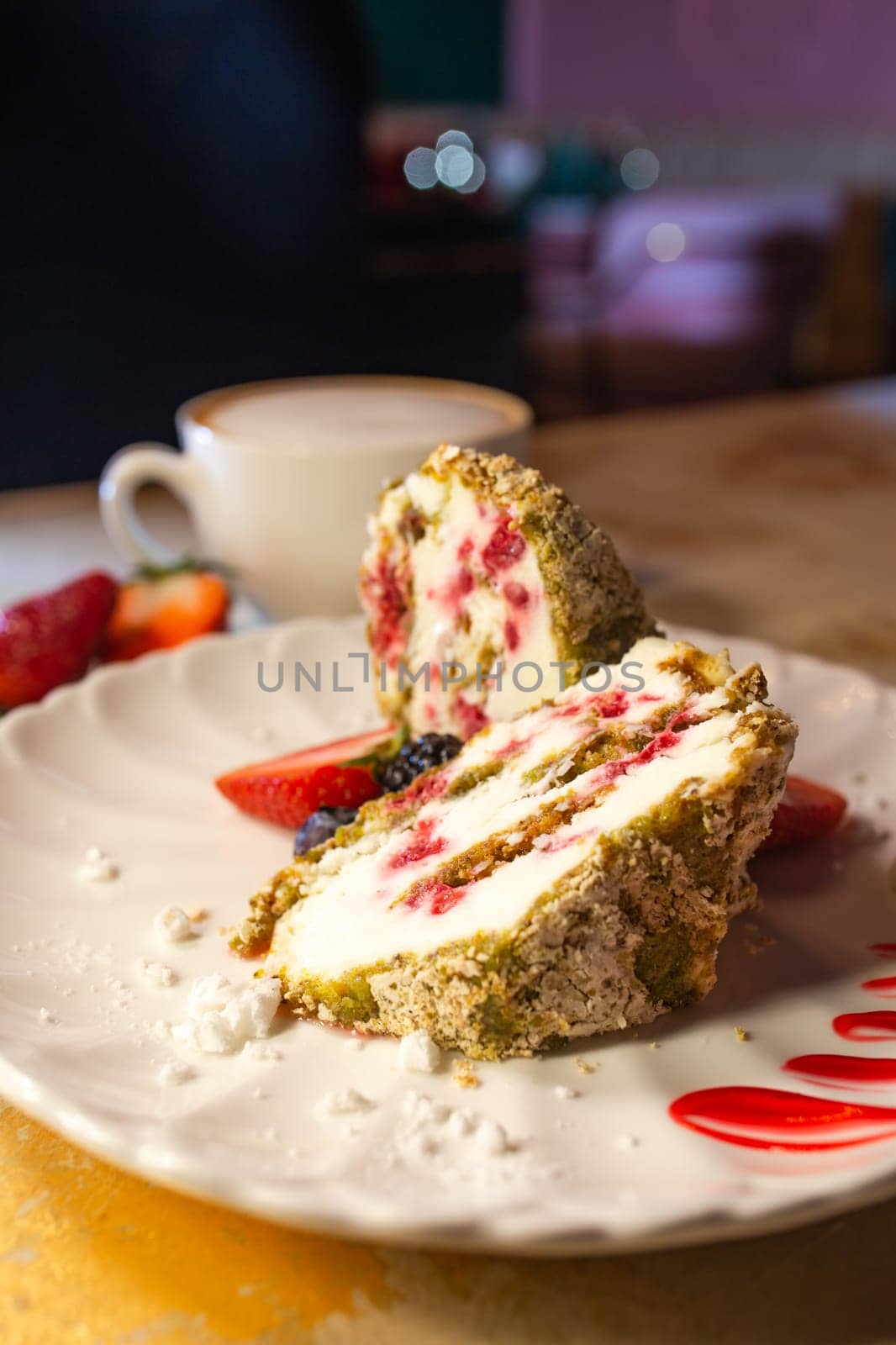 meringue roll in a section on a white plate close-up by Pukhovskiy