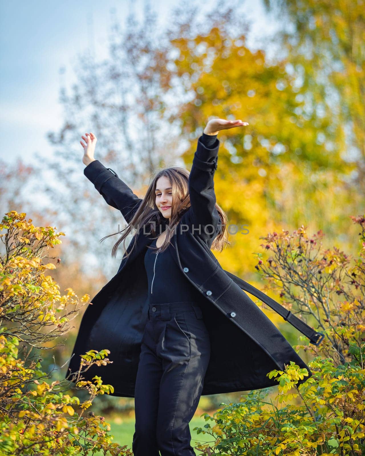 Happy girl spinning in the autumn park. by Yurich32